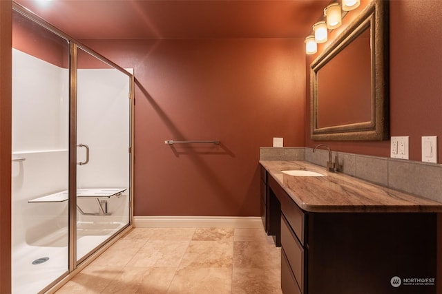 bathroom featuring vanity and a shower with door