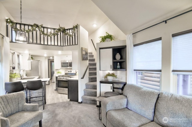 living room with high vaulted ceiling