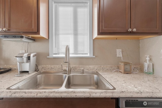 kitchen featuring dishwasher and sink