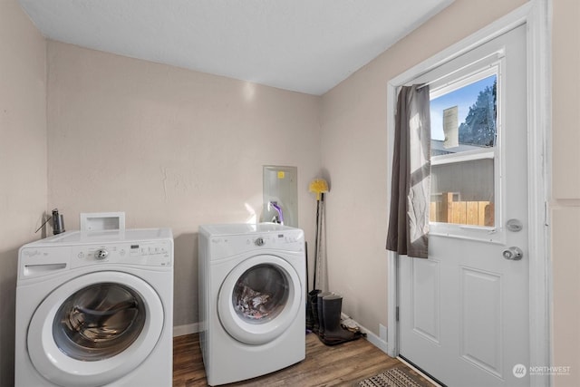 laundry area with hardwood / wood-style flooring and washer and clothes dryer