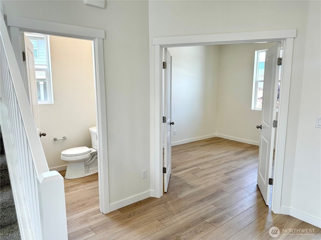 13414 187th Street Ct E Unit 20, Puyallup, WA 98374 - bathroom featuring wood finished floors, toilet, and baseboards