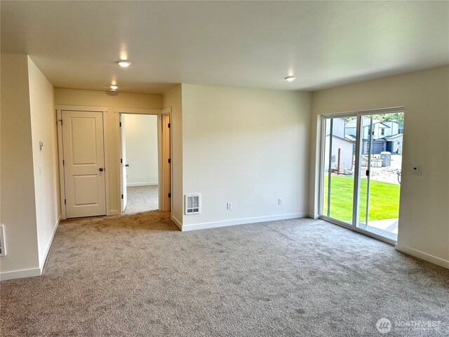 13414 187th Street Ct E Unit 20, Puyallup, WA 98374 - empty room featuring carpet and baseboards