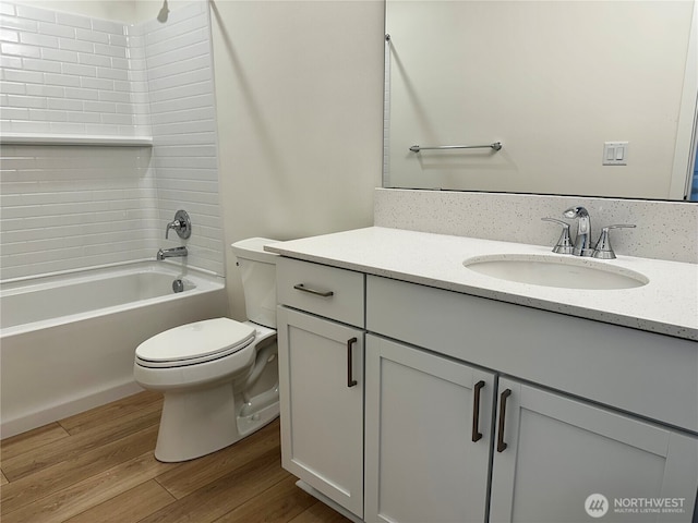 13414 187th Street Ct E Unit 20, Puyallup, WA 98374 - full bathroom with vanity, toilet, wood finished floors, and shower / bathtub combination