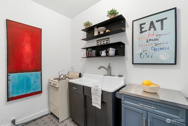 bar featuring sink and white electric range oven