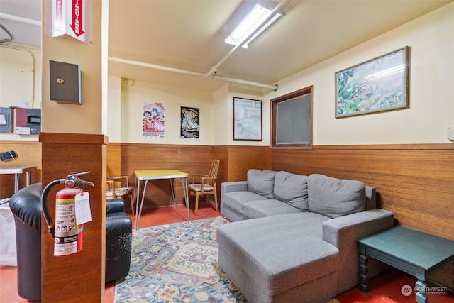 living room featuring wooden walls