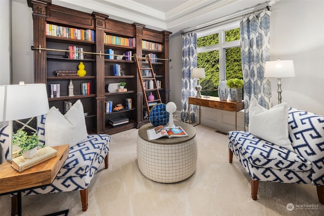 sitting room featuring carpet floors and ornamental molding