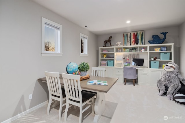 interior space featuring light colored carpet