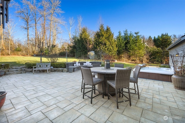 view of patio / terrace with a hot tub