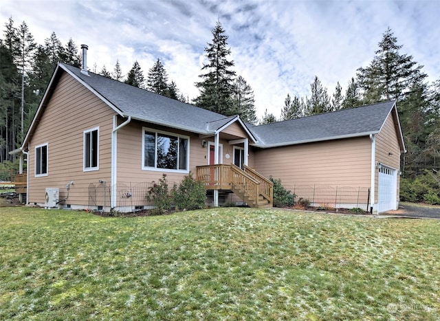 ranch-style home with a garage and a front lawn