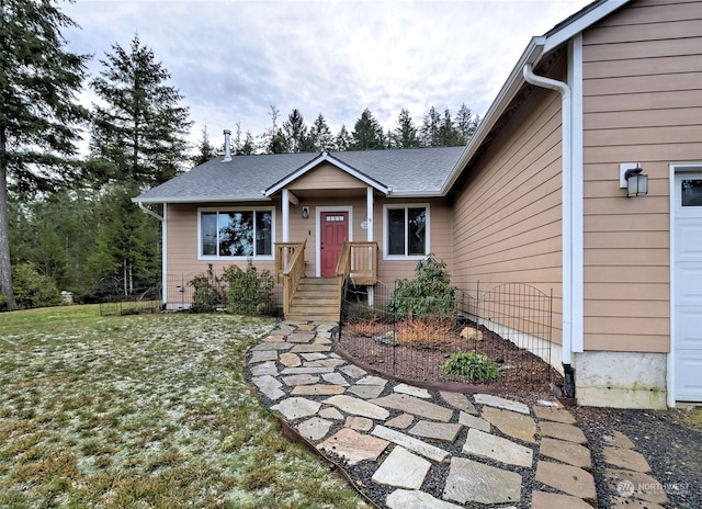 view of front facade featuring a garage and a front yard