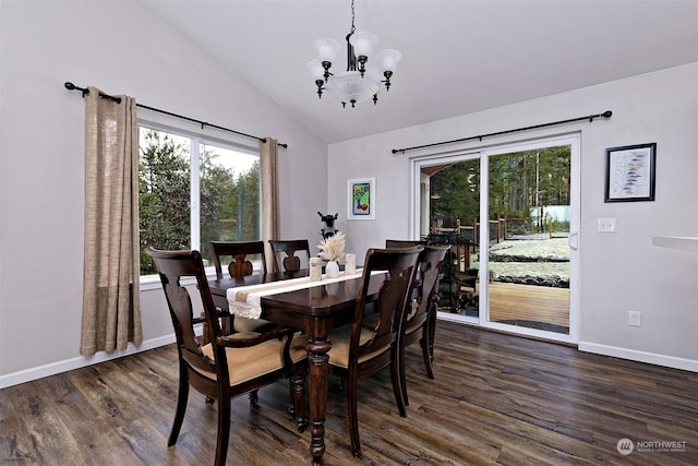 dining room featuring dark hardwood / wood-style flooring, plenty of natural light, a chandelier, and vaulted ceiling