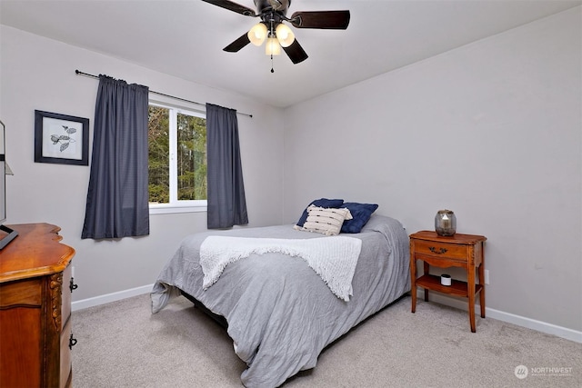 bedroom with light colored carpet and ceiling fan