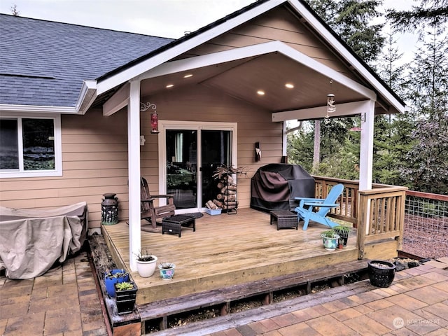 wooden terrace featuring a grill