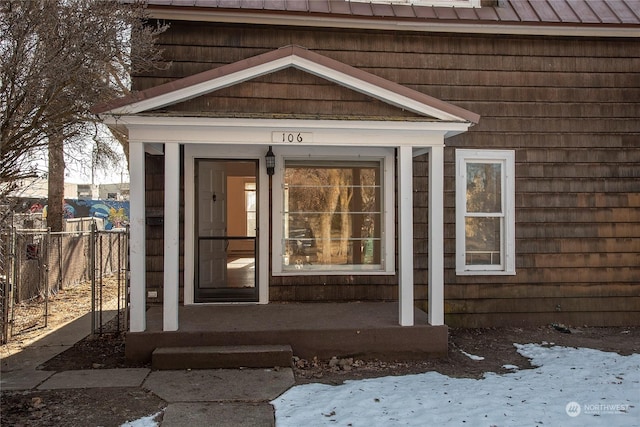 view of snow covered property entrance