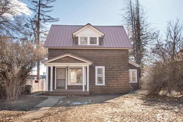 view of front of property featuring metal roof and a porch