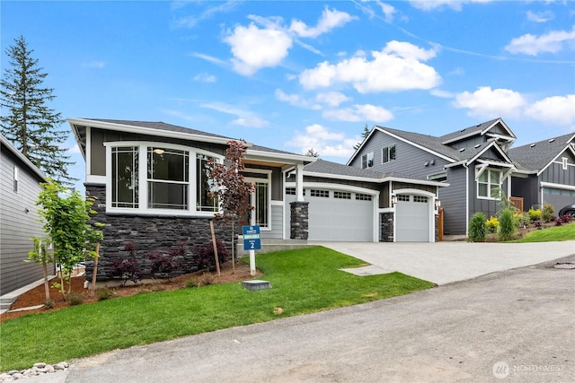 6612 6th St E, Tacoma, WA 98424 - view of front of property featuring stone siding, an attached garage, concrete driveway, a front yard, and board and batten siding