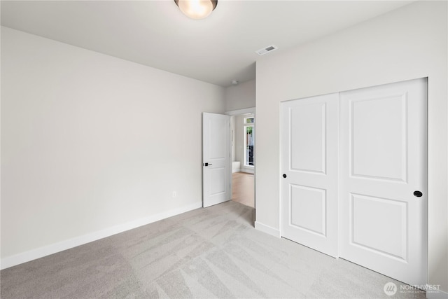 6612 6th St E, Tacoma, WA 98424 - unfurnished bedroom with light colored carpet, baseboards, and a closet