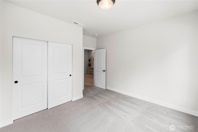 6612 6th St E, Tacoma, WA 98424 - unfurnished bedroom with light carpet, a closet, and baseboards