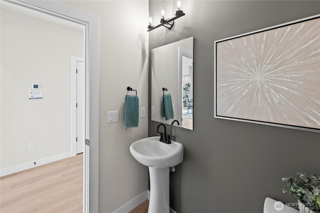 6612 6th St E, Tacoma, WA 98424 - half bath featuring wood finished floors and baseboards