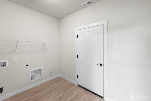6612 6th St E, Tacoma, WA 98424 - laundry area featuring gas dryer hookup, hookup for a washing machine, hookup for an electric dryer, light wood-style floors, and baseboards