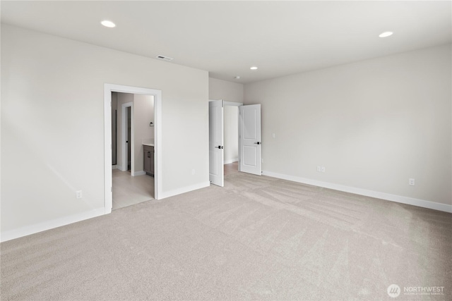 6612 6th St E, Tacoma, WA 98424 - unfurnished bedroom with light colored carpet, recessed lighting, baseboards, and connected bathroom