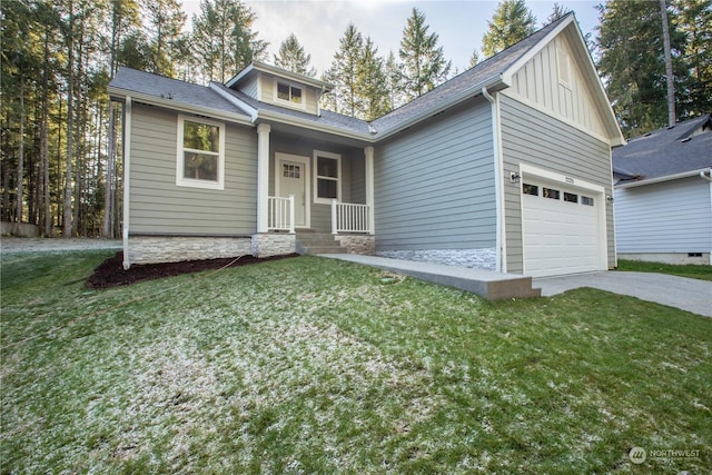 view of front of house with a garage and a front yard