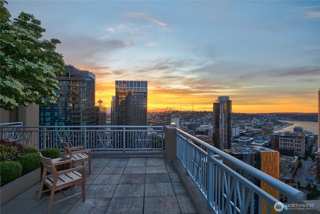 balcony at dusk with a city view