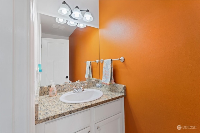 bathroom featuring vanity and visible vents