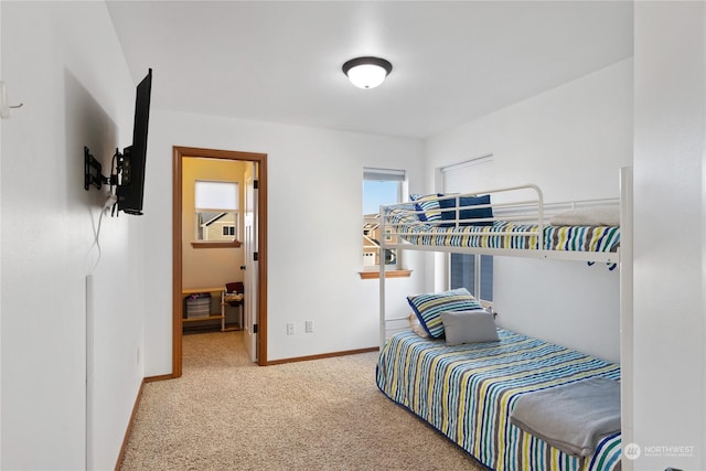 bedroom with baseboards and carpet floors