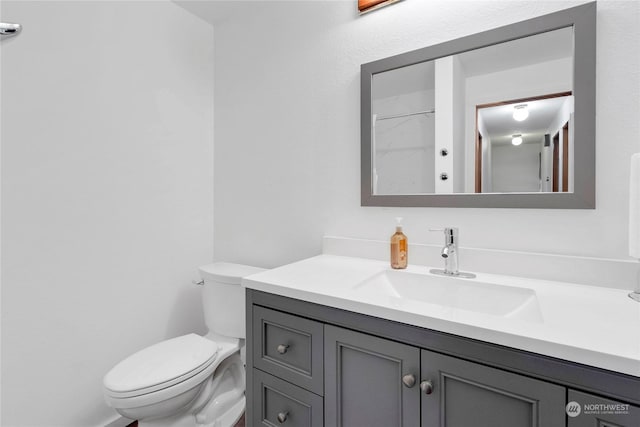 bathroom with vanity and toilet