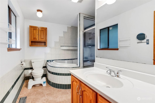 full bathroom with vanity, toilet, tile patterned flooring, and plus walk in shower