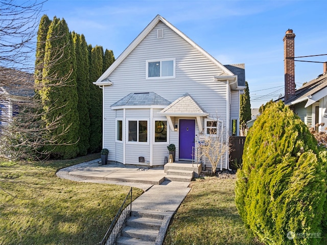 front facade with a front lawn