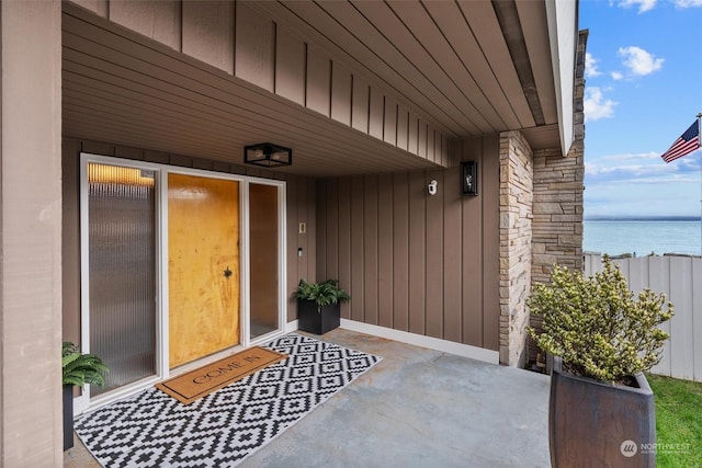 property entrance with a water view