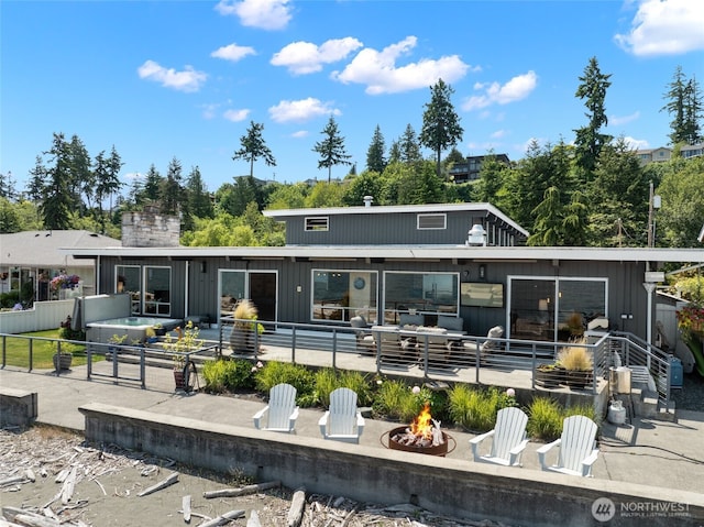1267 Beach Dr, Camano Island, WA 98282 - rear view of property with an outdoor fire pit and a patio area