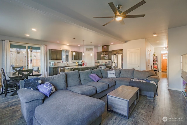 living room featuring beam ceiling, ceiling fan, and dark hardwood / wood-style flooring