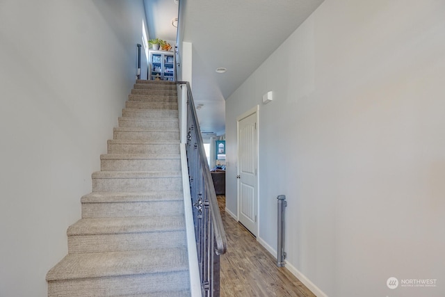 stairway with wood-type flooring