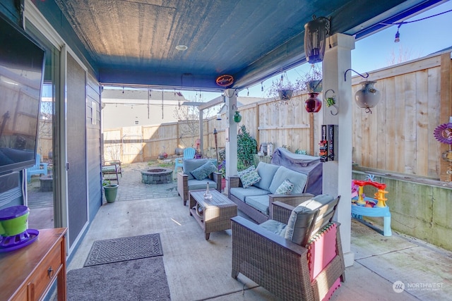 view of patio / terrace featuring an outdoor living space with a fire pit