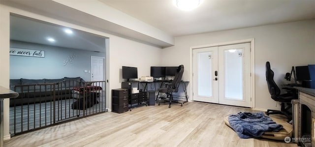 home office featuring french doors and light wood-type flooring