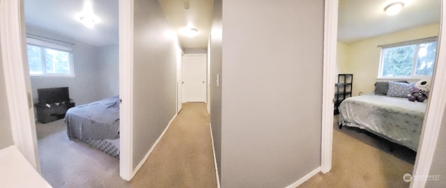 bedroom with vaulted ceiling and light carpet