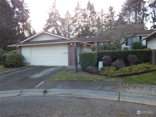 single story home featuring a garage