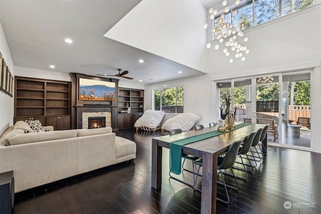 dining area featuring a fireplace and dark hardwood / wood-style floors