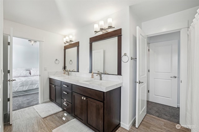 bathroom with vanity and hardwood / wood-style flooring