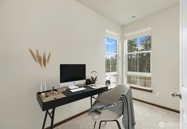 carpeted home office with baseboards and visible vents