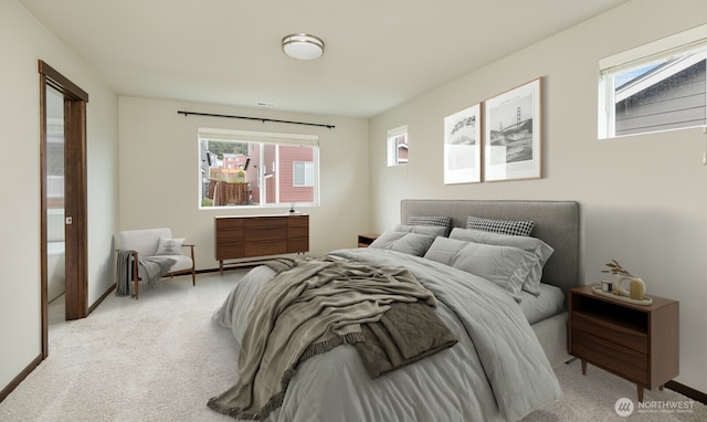 bedroom featuring carpet floors, multiple windows, and baseboards