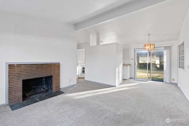 unfurnished living room with lofted ceiling with beams, carpet floors, a chandelier, and a fireplace