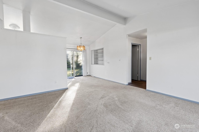 spare room featuring built in shelves, a chandelier, lofted ceiling with beams, and light carpet