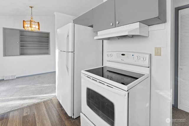 kitchen with pendant lighting, white appliances, dark hardwood / wood-style flooring, and a notable chandelier