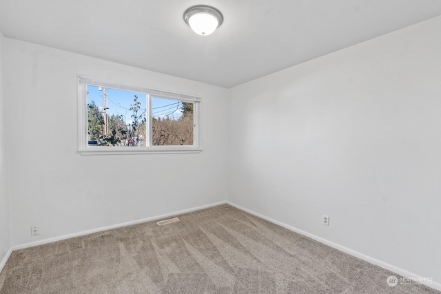 unfurnished room featuring carpet