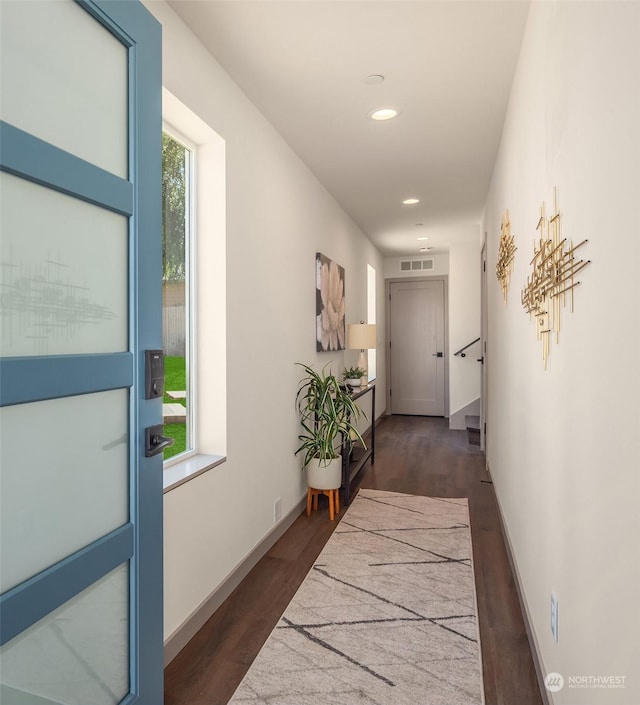 hallway featuring dark wood-type flooring