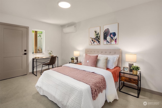 bedroom featuring light carpet and a wall unit AC